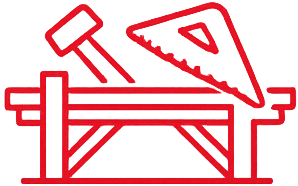 Red outline icon showing a hammer, a saw, and a workbench, symbolizing carpentry and DIY.